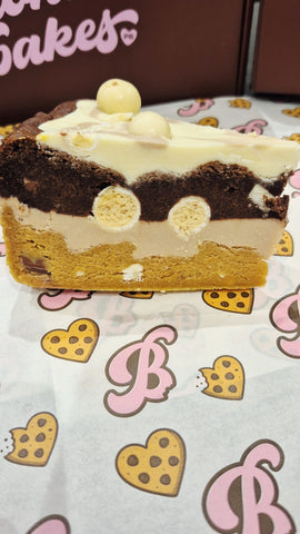 Kinder, milkybar & white malteeser cookie pie slice