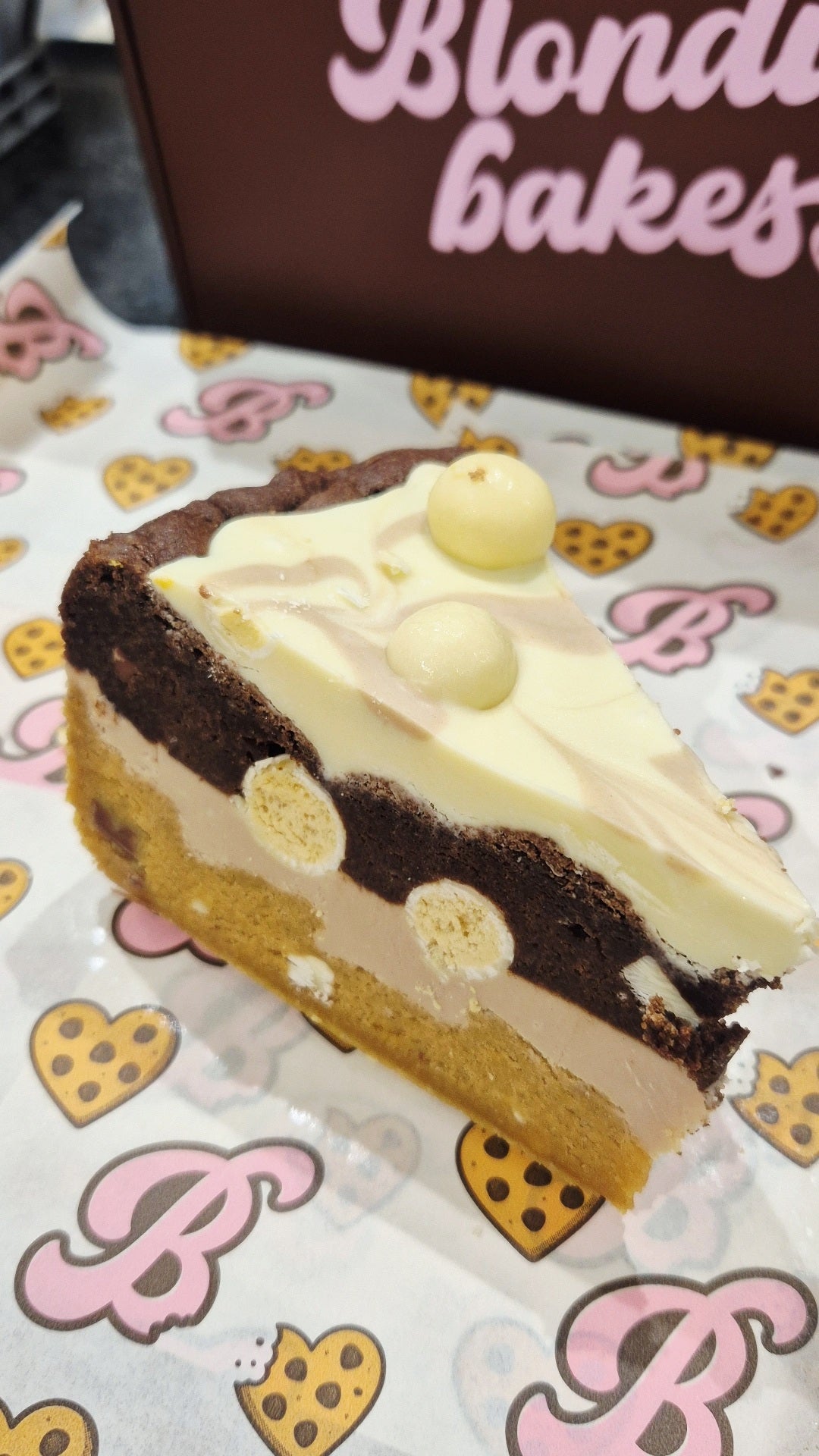 Kinder, milkybar & white malteeser cookie pie slice