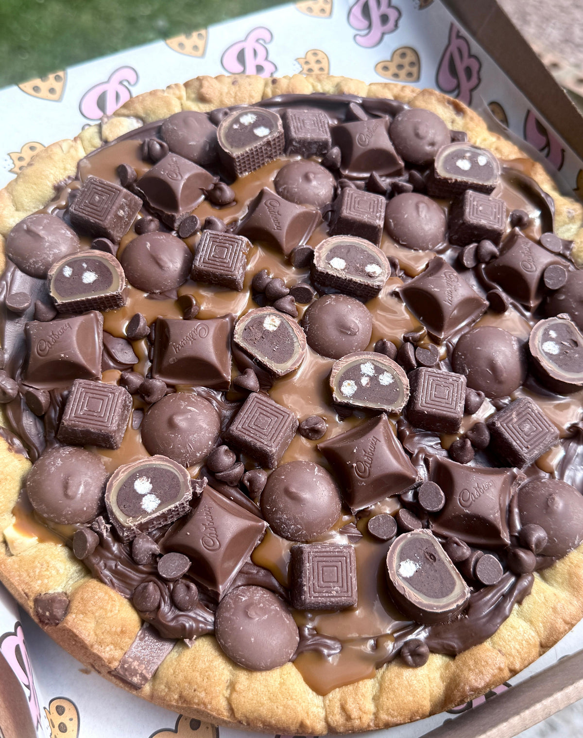 Large loaded caramel and milk choc cookie cake