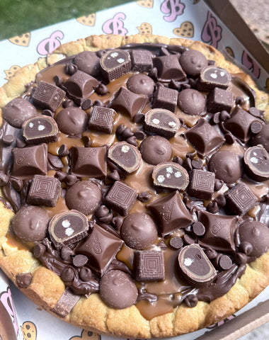 Large loaded caramel and milk choc cookie cake